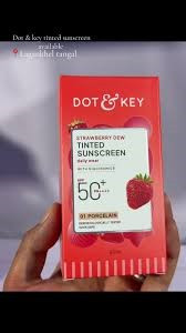 Dot & Key Strawberry Dew Tinted Sunscreen in the shade 01 Porcelain, featuring a bright red and white box