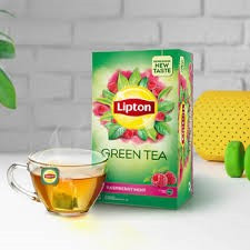 Lipton Green Tea Raspberry Mint flavored tea bags featuring a vibrant green and pink packaging with graphic raspberries and leaves