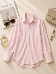 light pink long-sleeve button-down blouse features a classic lapel collar and unique decorative button detailing along the front placket