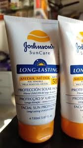 Johnson's Sun Care Long-Lasting Facial Sun Protection cream in a bright yellow packaging.