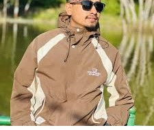 This is a stylish tan hooded jacket featuring bold white "ENDEATNSA" lettering running down the front placket.