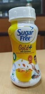 Sugar Free Gold Low Calorie Sweetener powder by Zydus, featuring a white cap and a yellow and white labe