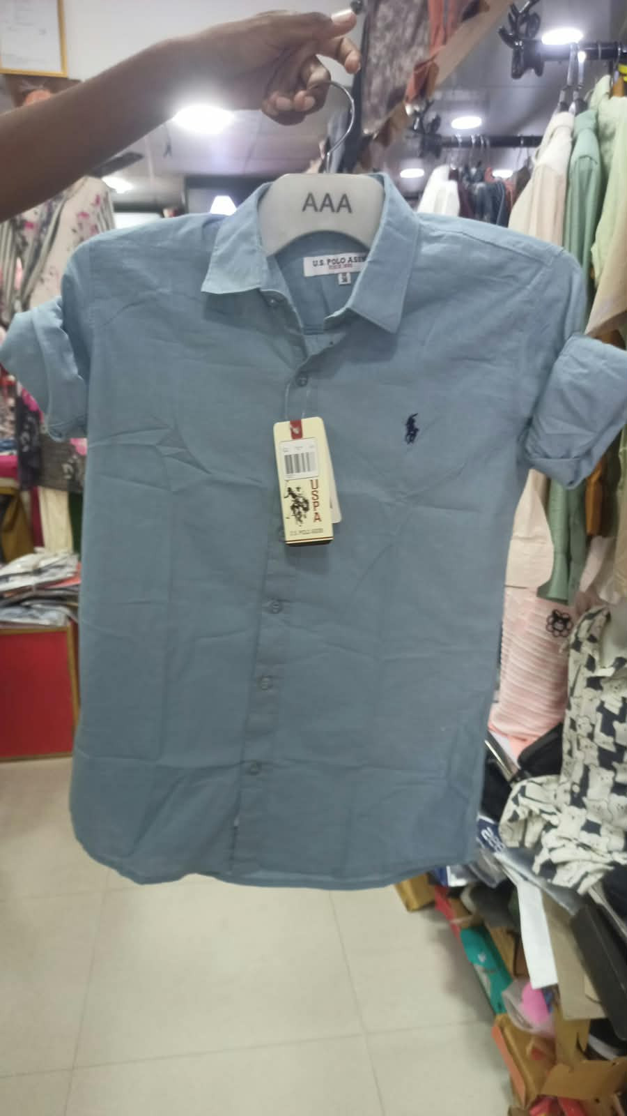 Here are black button-down and short-sleeve shirt alternatives from brands like U.S. Polo Assn. and Polo Ralph Lauren: